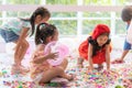 Kids playing and throwing paper and balloon in kid party