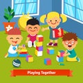 Kids playing together in kindergarten room Royalty Free Stock Photo