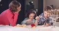 Kids playing with dreidels during Hanukka at home