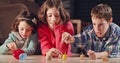 Kids playing with dreidels during Hanukka at home