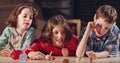 Kids playing with dreidels during Hanukka at home