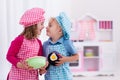 Kids playing with toy kitchen Royalty Free Stock Photo