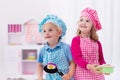 Kids playing with toy kitchen Royalty Free Stock Photo