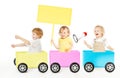 Kids Playing Train Advertising Toy. Children with Blank Ads Board and Megaphone on White Royalty Free Stock Photo