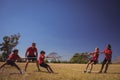 Kids playing tug of war during obstacle course training Royalty Free Stock Photo