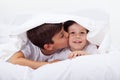 Kids playing under the quilt Royalty Free Stock Photo