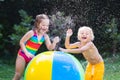 Kids playing with water ball toy Royalty Free Stock Photo