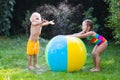 Kids playing with water ball toy Royalty Free Stock Photo