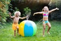 Kids playing with water ball toy sprinkler Royalty Free Stock Photo