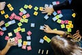 Kids playing wooden alphabets letters vocabulary ga Royalty Free Stock Photo