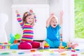 Kids playing with wooden blocks Royalty Free Stock Photo