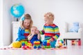 Kids playing with wooden toy train Royalty Free Stock Photo