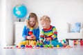 Kids playing with wooden toy train Royalty Free Stock Photo
