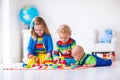 Kids playing with wooden toy train Royalty Free Stock Photo