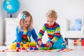 Kids playing with wooden toy train Royalty Free Stock Photo