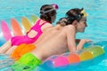 Kids on a pool float Royalty Free Stock Photo