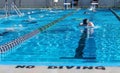 Kids practice swimming at a local swim meet Royalty Free Stock Photo