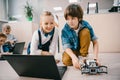 kids programming robot on floor