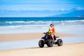 Kids on quad bike. Off road all terrain vehicle. Royalty Free Stock Photo