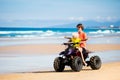 Kids on quad bike. Off road all terrain vehicle. Royalty Free Stock Photo