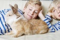 Kids with rabbit at home. Royalty Free Stock Photo