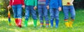 Kids in rain boots. Rubber boots for children. Royalty Free Stock Photo