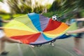 Kids Rainbow Umbrella Parachute Toy, Outdoor Cooperative Games For Children Royalty Free Stock Photo