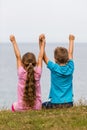 Kids with raised arms Royalty Free Stock Photo