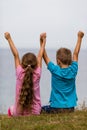 Kids with raised arms Royalty Free Stock Photo