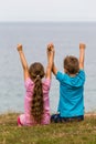 Kids with raised arms Royalty Free Stock Photo