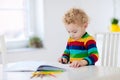 Kids read, write and paint. Child doing homework. Royalty Free Stock Photo