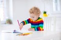 Kids read, write and paint. Child doing homework. Royalty Free Stock Photo