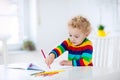 Kids read, write and paint. Child doing homework. Royalty Free Stock Photo