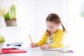 Kids read, write and paint. Child doing homework. Royalty Free Stock Photo