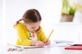 Kids read, write and paint. Child doing homework. Royalty Free Stock Photo