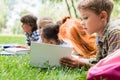 Kids reading books in park Royalty Free Stock Photo