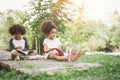 Kids reading with friend. Royalty Free Stock Photo