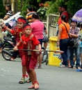 Kids in red traditional outfit performing warrior dance of Kabasaran