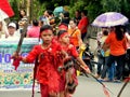 Kids in red traditional outfit performing warrior dance of Kabasaran