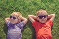 Kids relaxing on the grass Royalty Free Stock Photo