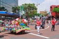 Christmas parade. Children being pulled in a trailer full of presents