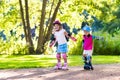 Kids roller skating in summer park Royalty Free Stock Photo