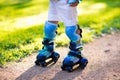 Kids roller skating in summer park Royalty Free Stock Photo