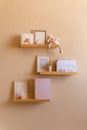 Kids room decor, wooden floating shelves interior child bedroom, empty wooden picture frame, books