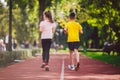 Kids run. Healthy sport. Child sport, heterosexual twins running on track, fitness. Joint training. Running training outdoor Royalty Free Stock Photo