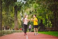 Kids run. Healthy sport. Child sport, heterosexual twins running on track, fitness. Joint training. Running training outdoor Royalty Free Stock Photo