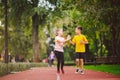 Kids run. Healthy sport. Child sport, heterosexual twins running on track, fitness. Joint training. Running training outdoor Royalty Free Stock Photo