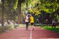 Kids run. Healthy sport. Child sport, heterosexual twins running on track, fitness. Joint training. Running training outdoor Royalty Free Stock Photo