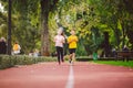 Kids run. Healthy sport. Child sport, heterosexual twins running on track, fitness. Joint training. Running training outdoor Royalty Free Stock Photo