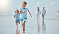 Kids, running and beach with a family on holiday or summer vacation together outdoor in nature. Children, travel and Royalty Free Stock Photo